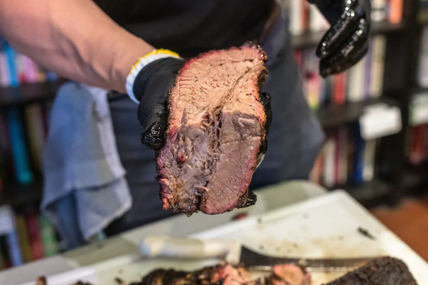Pitmaster holding a whole brisket
